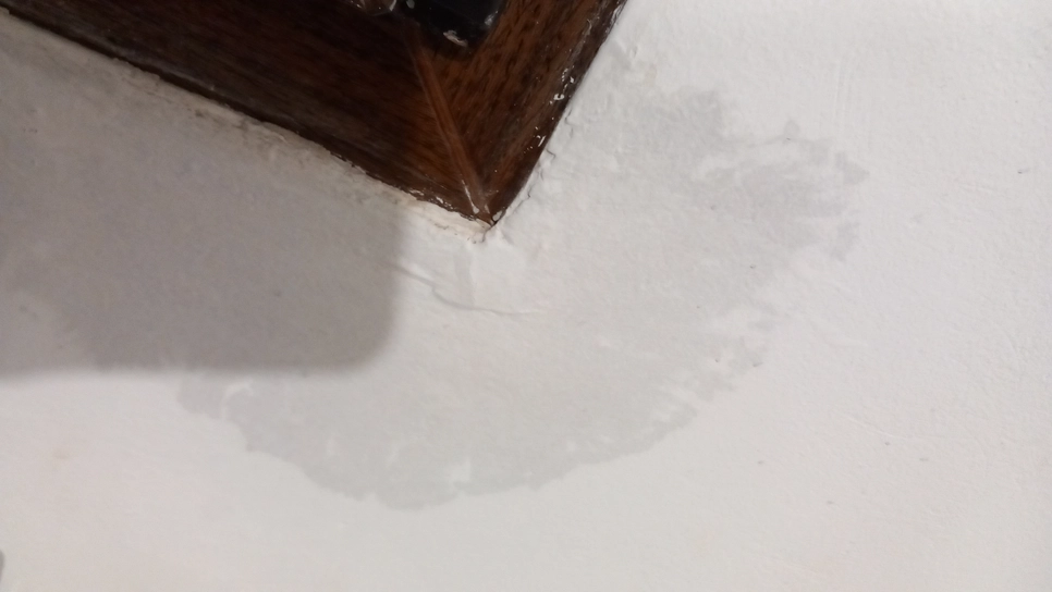 Ceiling water damage near wooden frame (97722)